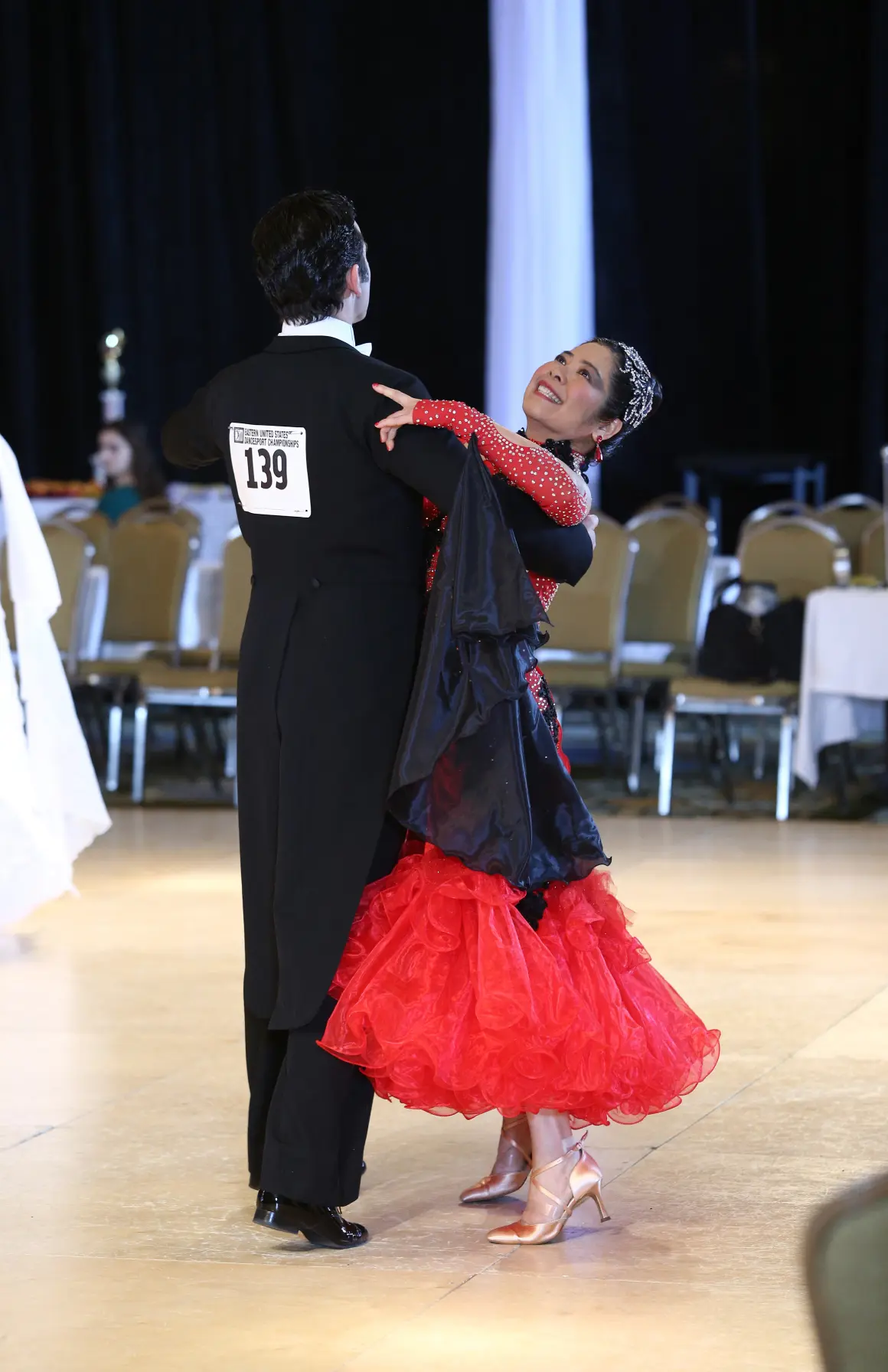 Couple dancing Latin at a ballroom competition